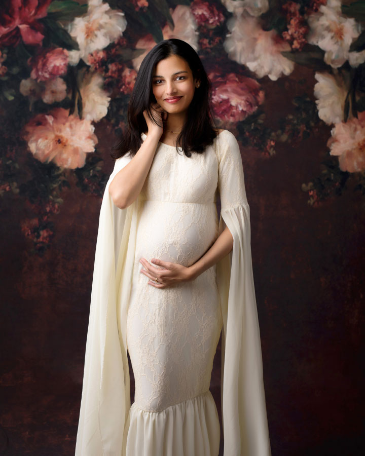 Mableton maternity photographer, studio portrait on floral backdrop