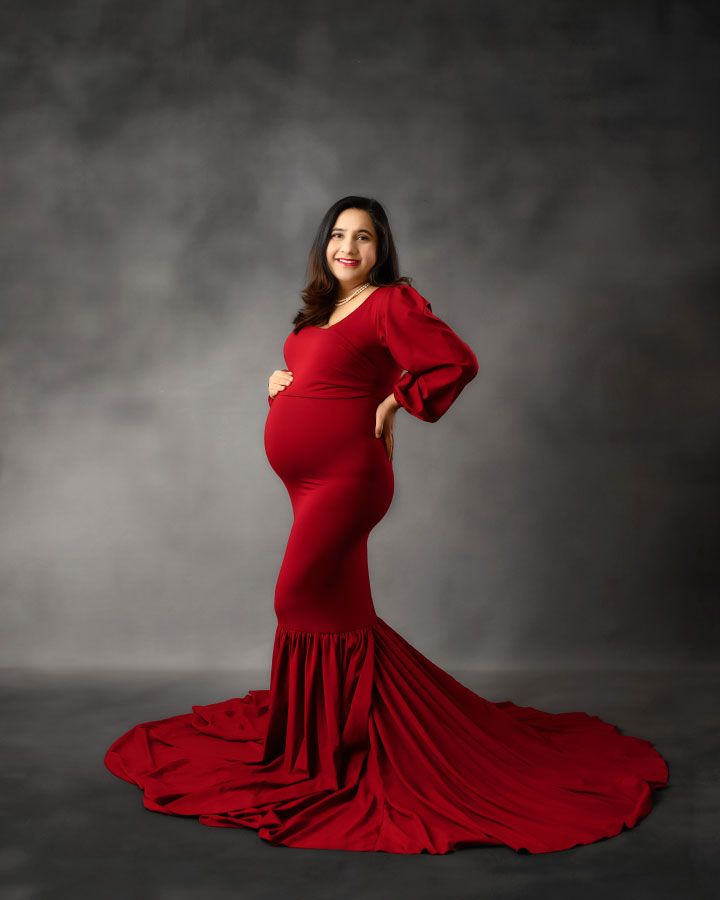 maternity photographer near Villa Rica, studio portrait in long red dress