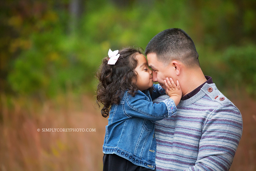 daddy and daughter during an outdoor photography session by Douglasville family photographer