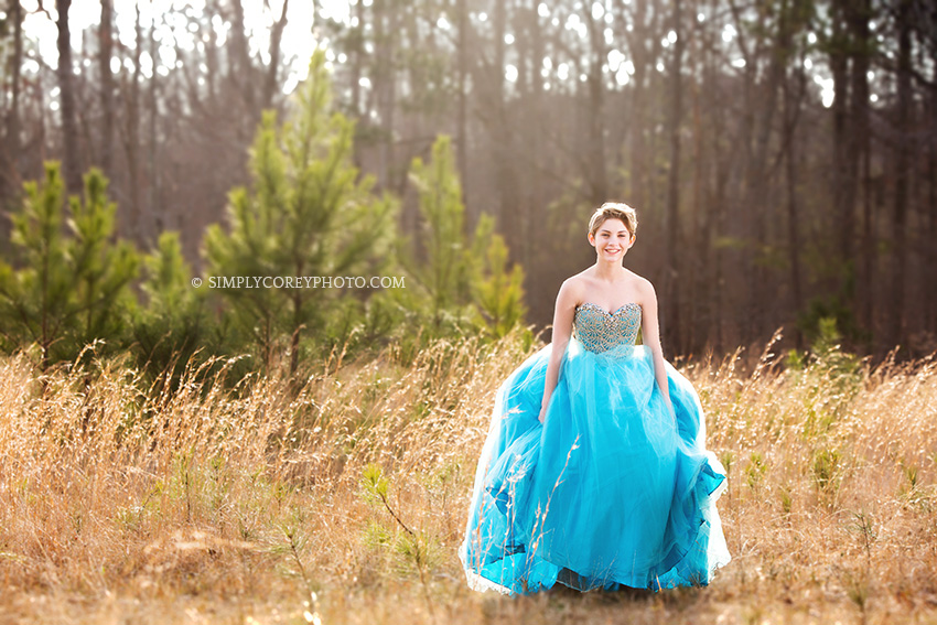 teen in a blue pageant dress by Atlanta prom photographer