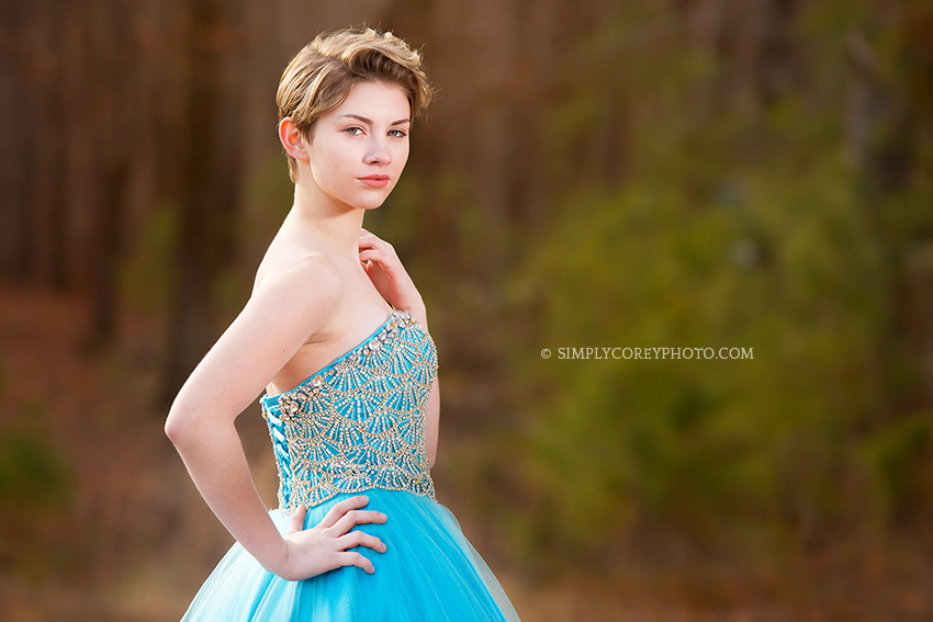 teen in a blue pageant dress by Atlanta prom photographer