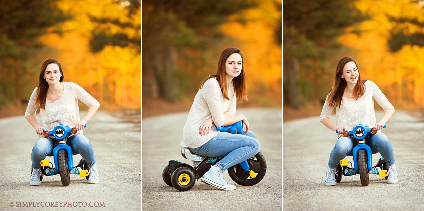 fun photos of a teen girl on a Batman bike by Atlanta senior portrait photographer