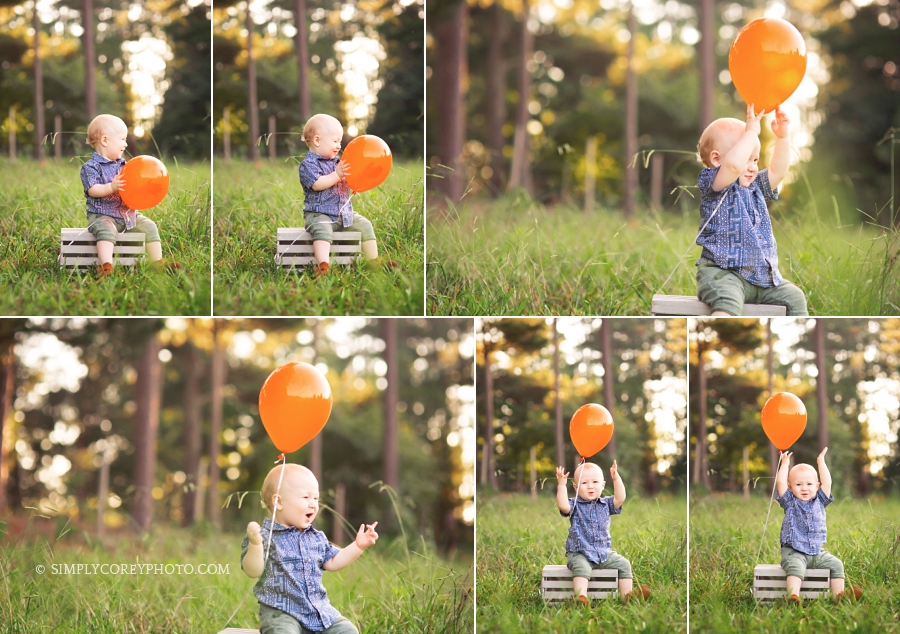 boy with a balloon during an outdoor one year photography session by Atlanta baby photographer