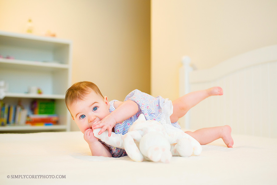 baby girl on a bed by Atlanta baby photographer