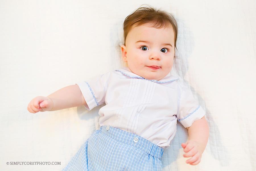 baby boy on a bed by Atlanta baby photographer