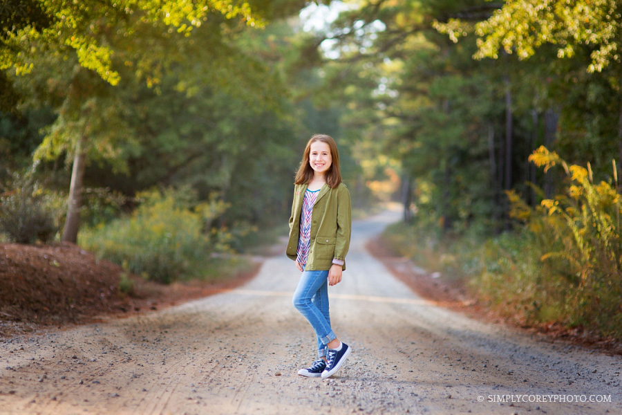 girl on a dirt road in the fall by Atlanta tween photographer