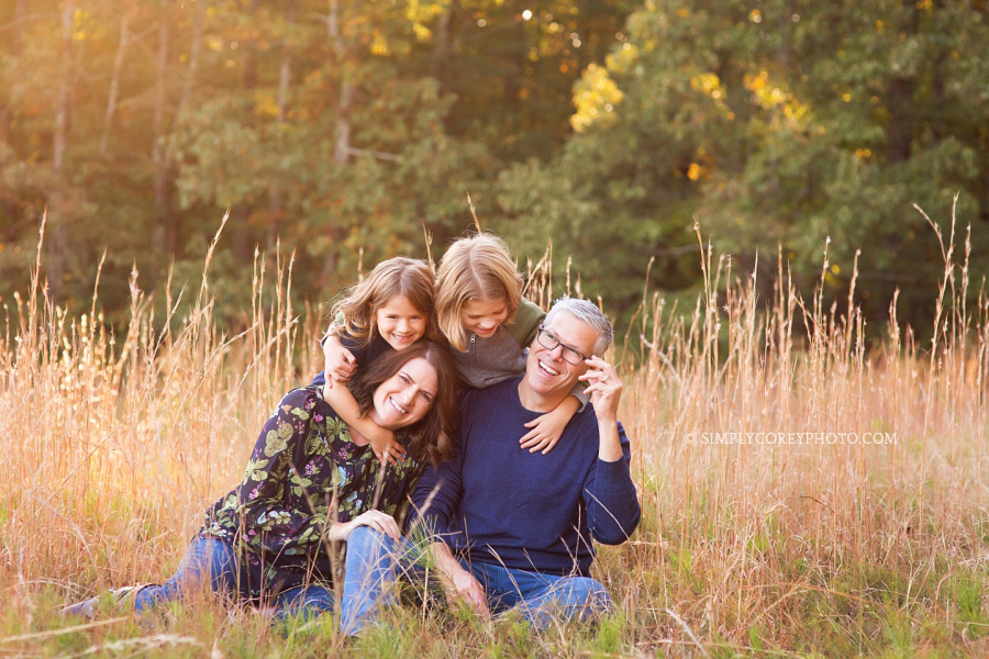 parents and kids in a field of tall grass by Atlanta family photographer