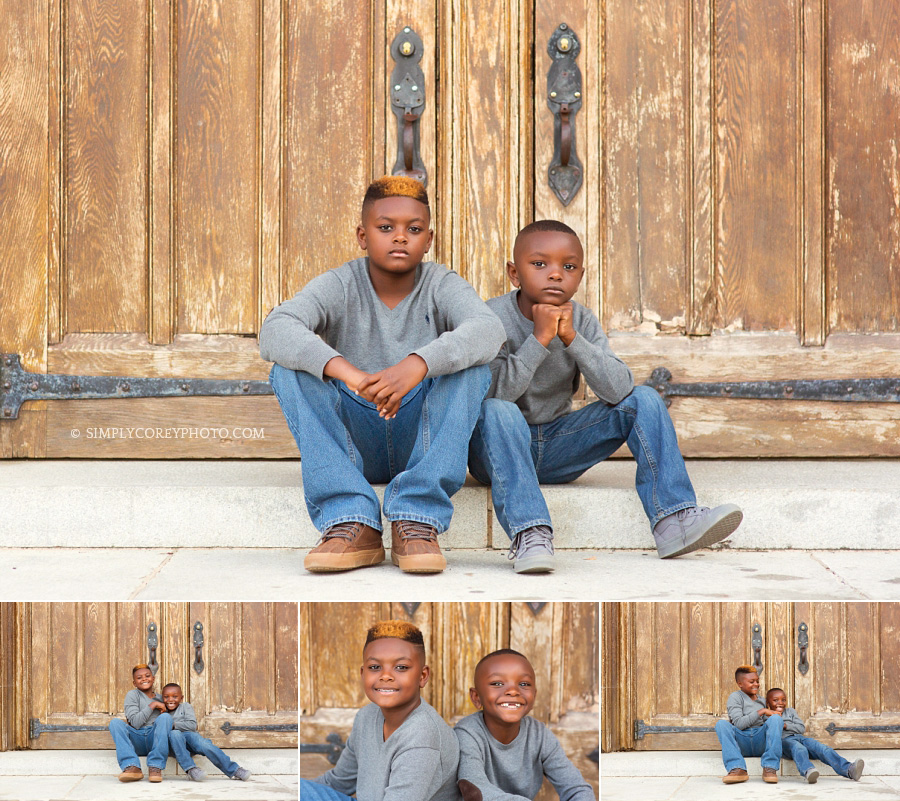 brothers by wooden doors at Berry College by Atlanta children's photographer