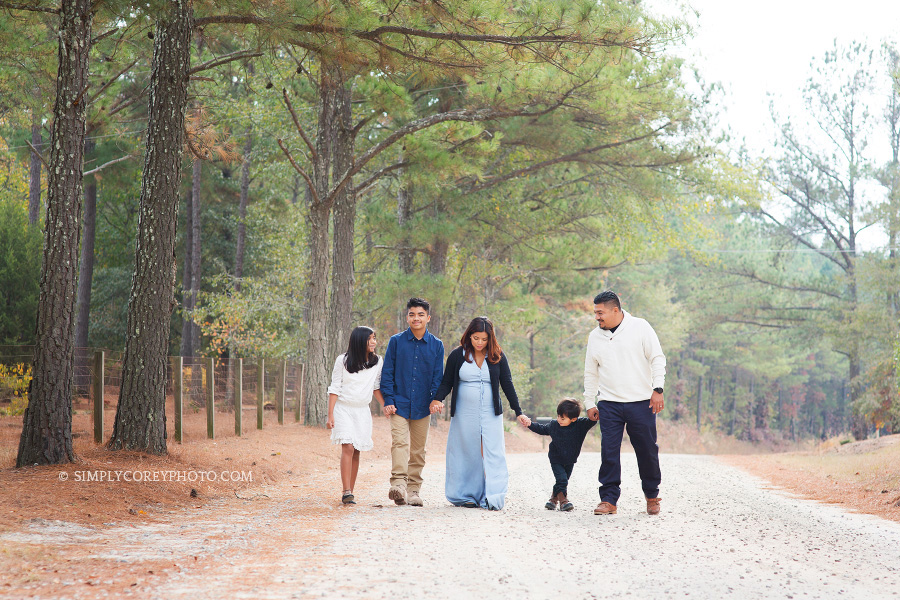 family walking down a dirt road by Atlanta family photographer