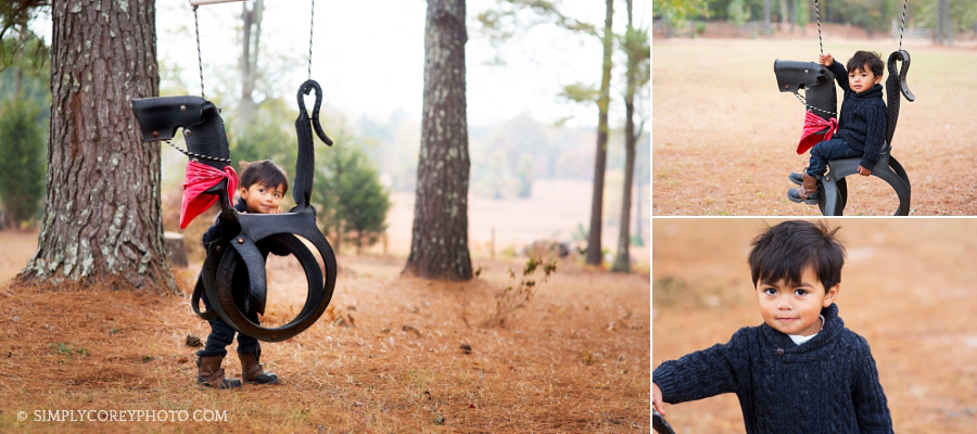 toddler boy with a tire swing by Villa Rica children's photographer