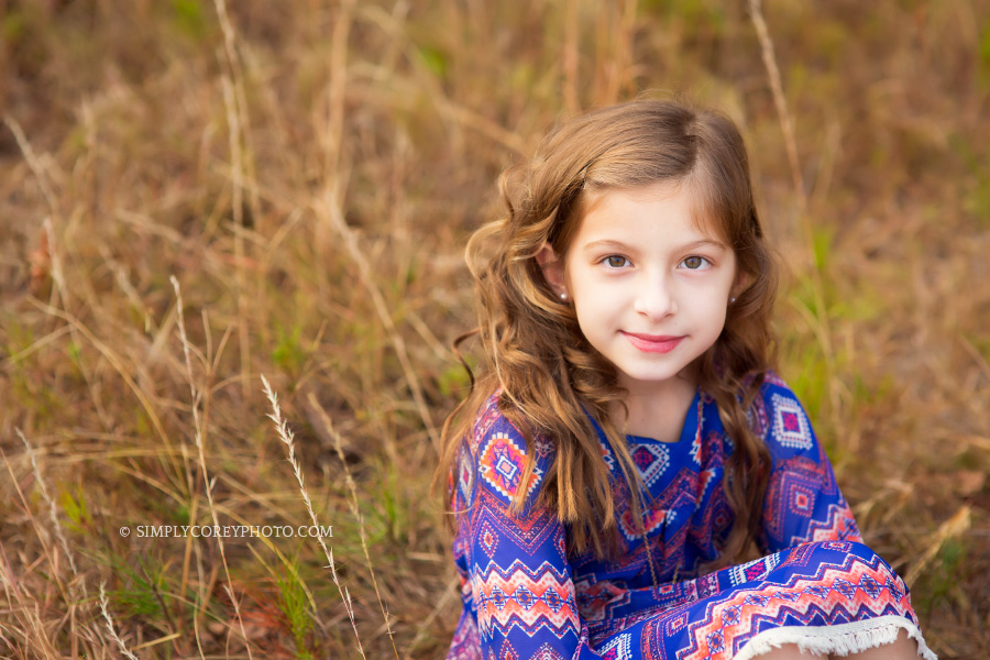 little girl in a field by Atlanta children's photographer
