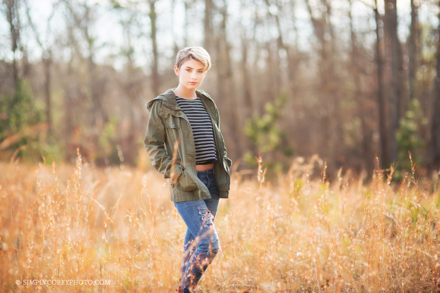 teen girl model in a field by Carrollton teen photographer
