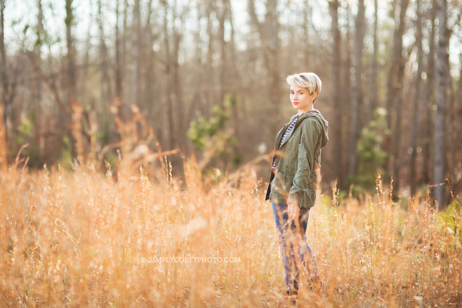 teen girl model in a field by Douglasville teen photographer