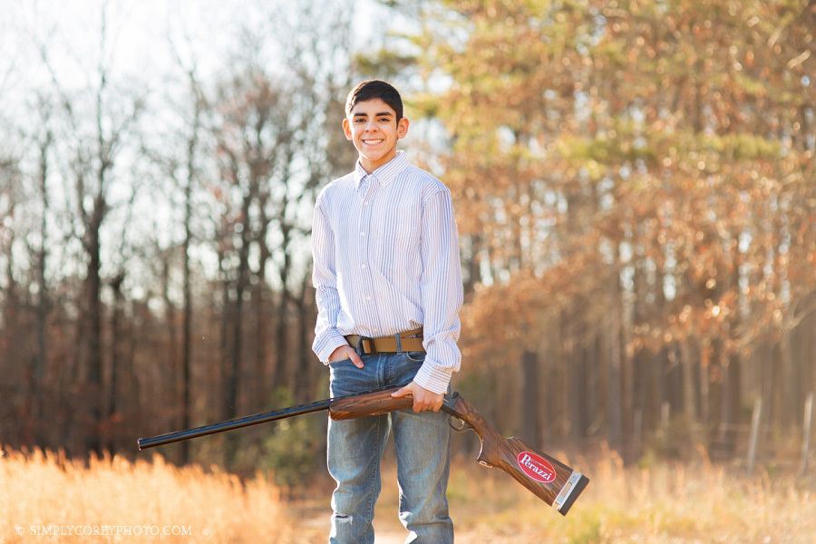boy with a Perazzi shotgun by Newnan senior portrait photographer