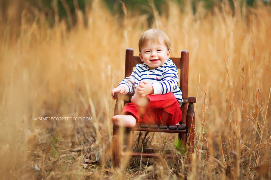 one year old in a rocking chair in a field, baby photographer Atlanta