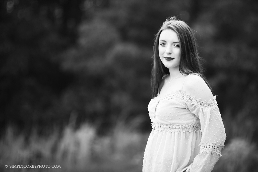 black and white photo of a teen girl outside by Carrollton senior portrait photographer