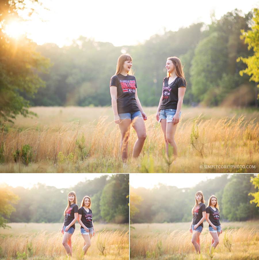 Atlanta senior portraits of two girls in UGA shirts outside in a field