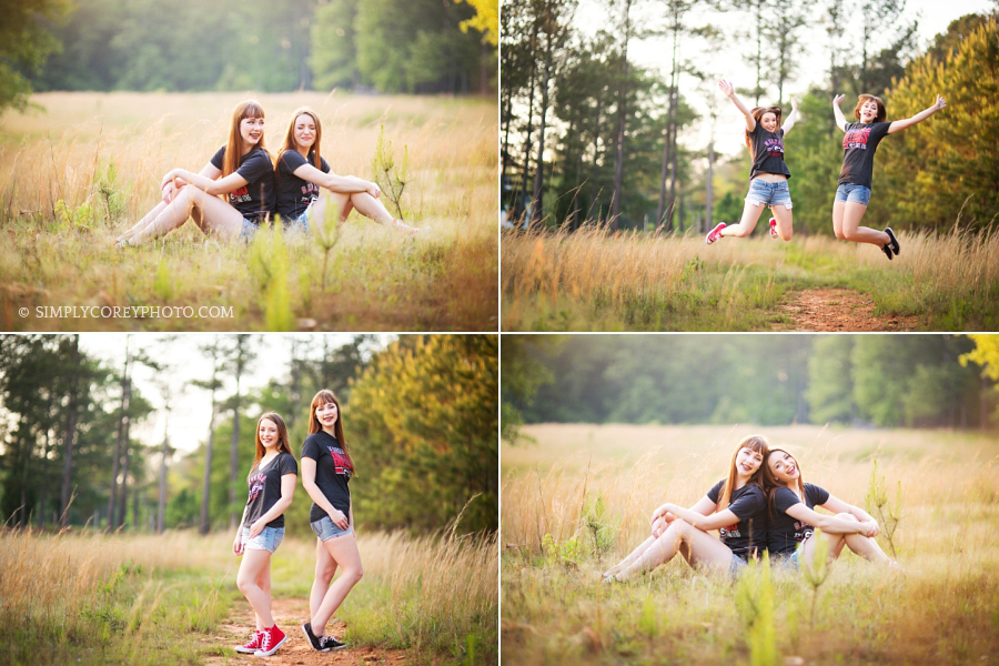 Newnan senior portraits of two girls in UGA shirts outside in a field