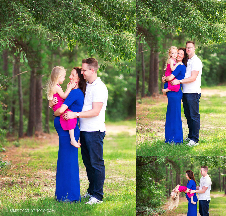 family of 3 outside by Carrollton maternity photographer
