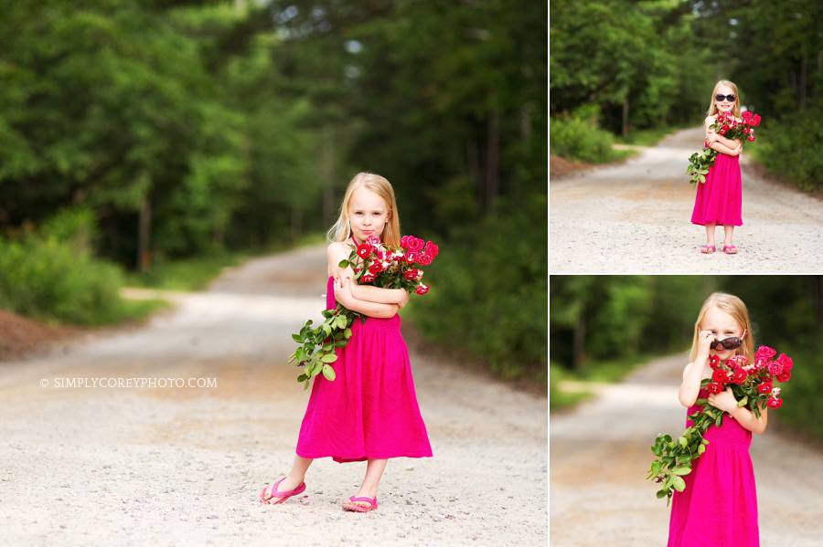 children's photography Atlanta, girl holding pink flowers on a country dirt road
