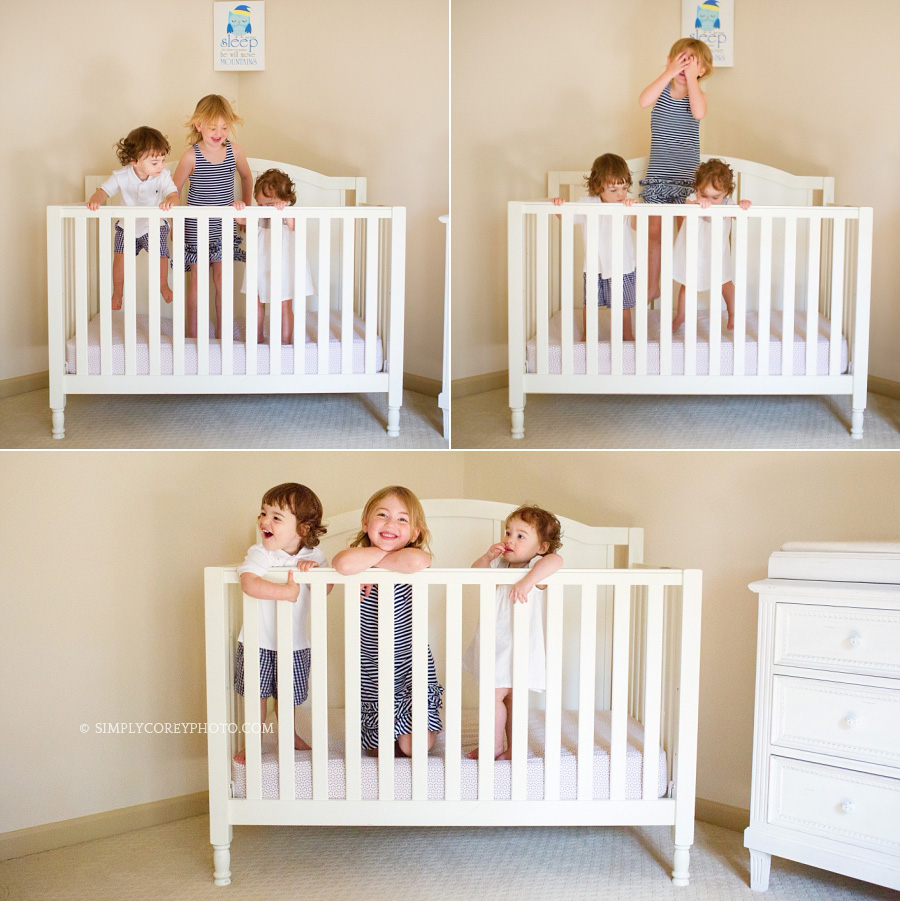 Carrollton family photography of siblings in a crib