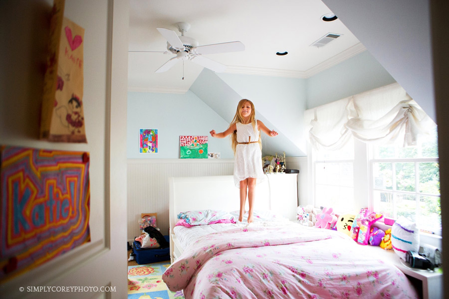 girl jumping on the bed by Atlanta lifestyle photographer 