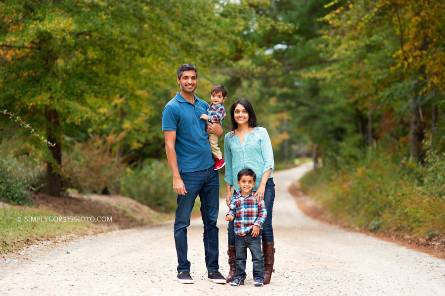 Carrollton family photography of fall portraits on a country road with two kids
