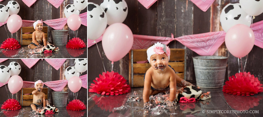 Atlanta cake smash photographer using cow balloons for a baby girl