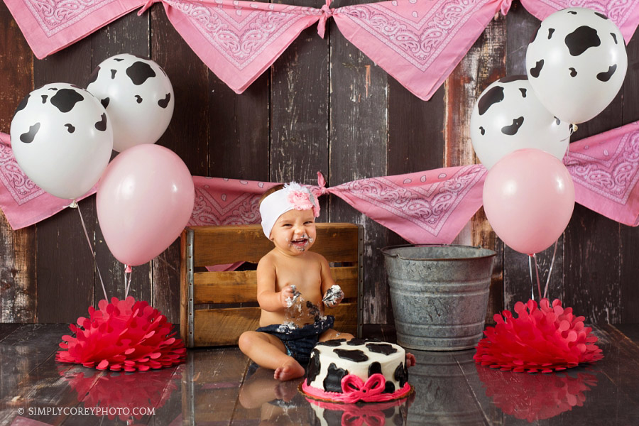 studio cake smash with cow balloons by Newnan baby photographer