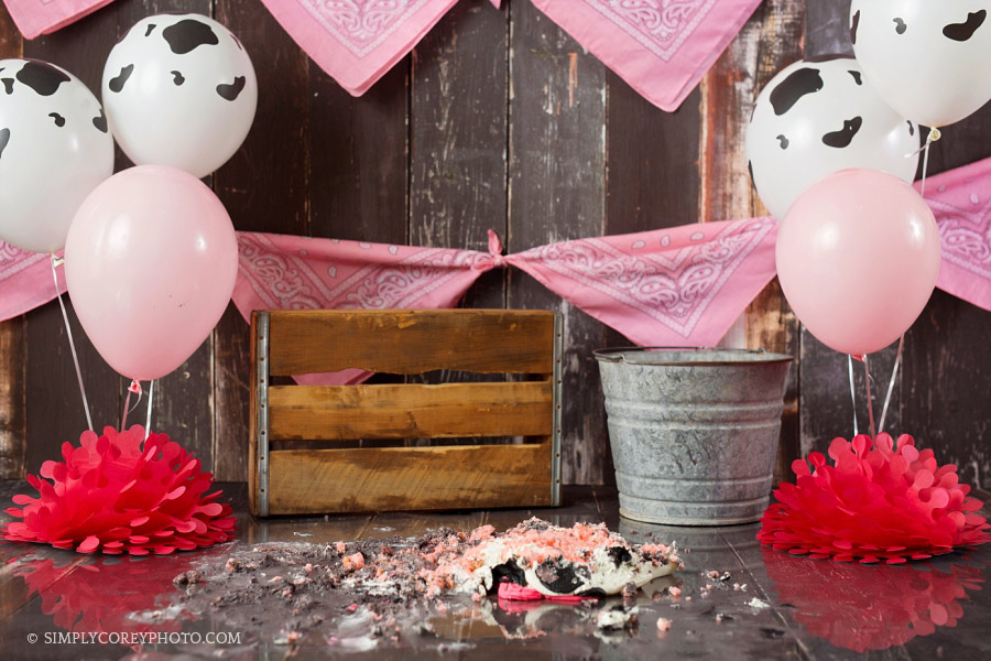 smashed cow cake in studio by Douglasville baby photographer