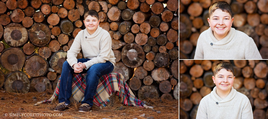 Newnan children's photographer, tween boy near a wood pile