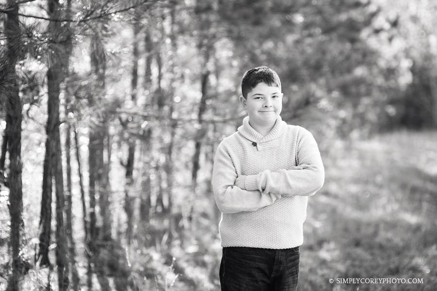 black and white portrait of a boy in a field Atlanta tween photographer