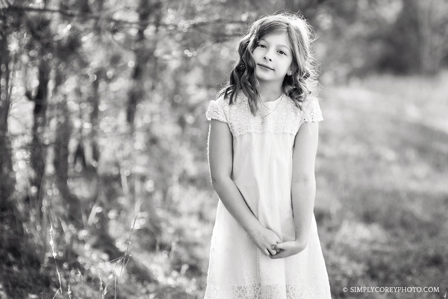 black and white portrait of a girl in a field by Atlanta child photographer