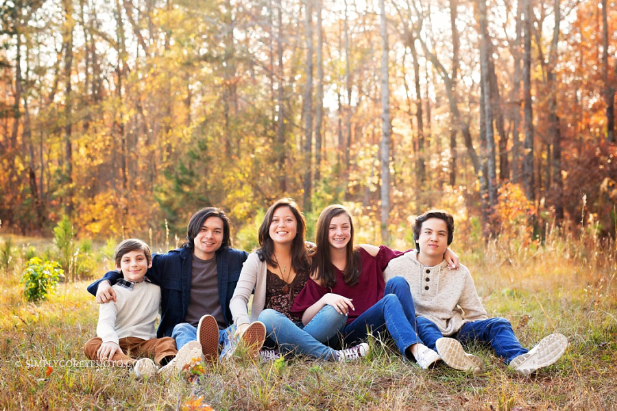 outdoor sibling portrait in a field by Newnan family photographer