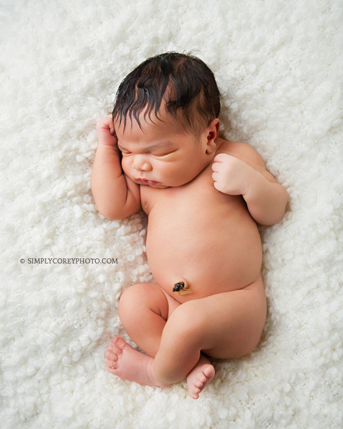 big baby boy on fluffy white blanket by Carrollton newborn photographer