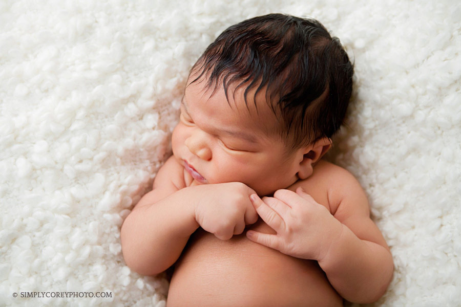 big baby boy on fluffy white blanket by Villa Rica newborn photographer
