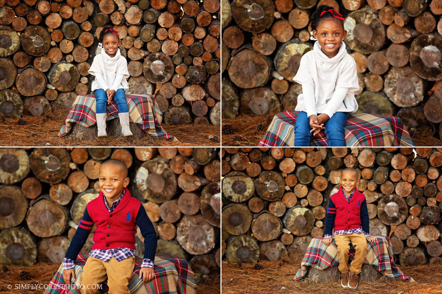 kids outdoor portraits with a log wood wall by Villa Rica children's photographer