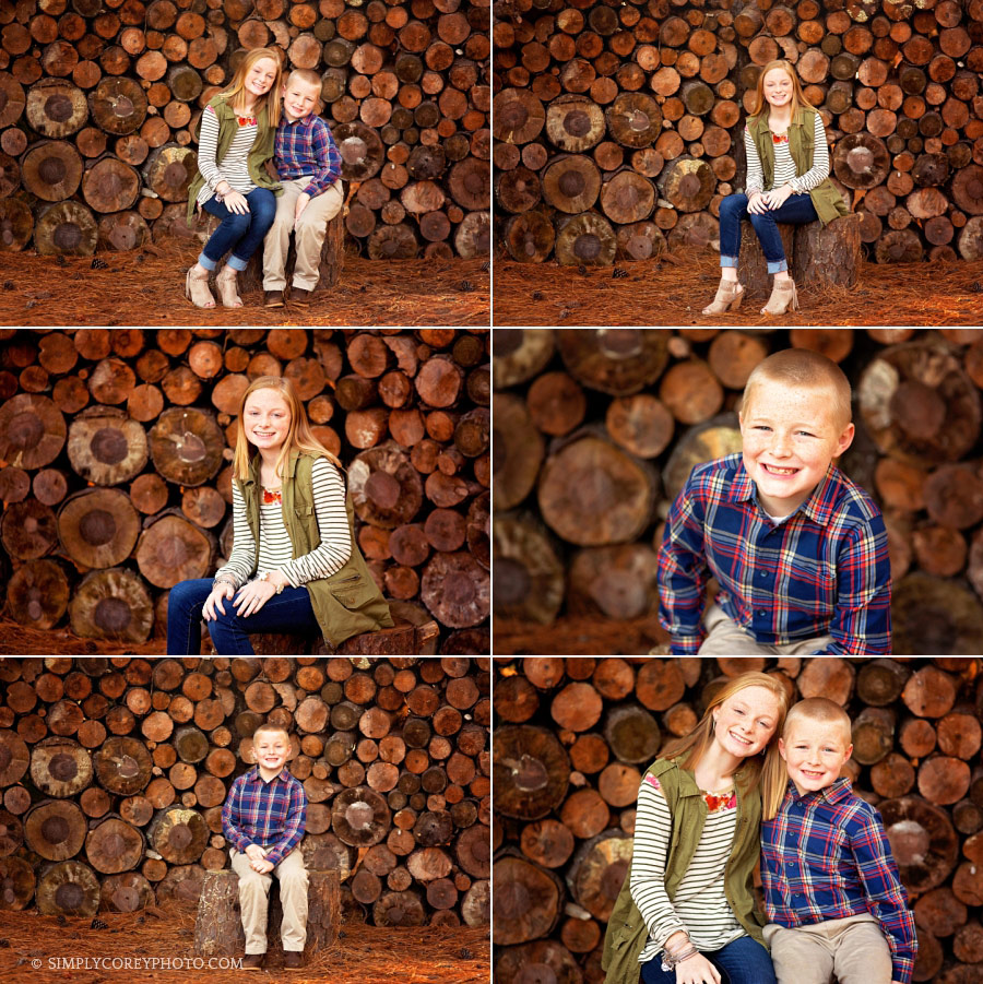 children's photographer Atlanta, siblings next to a log wall outside