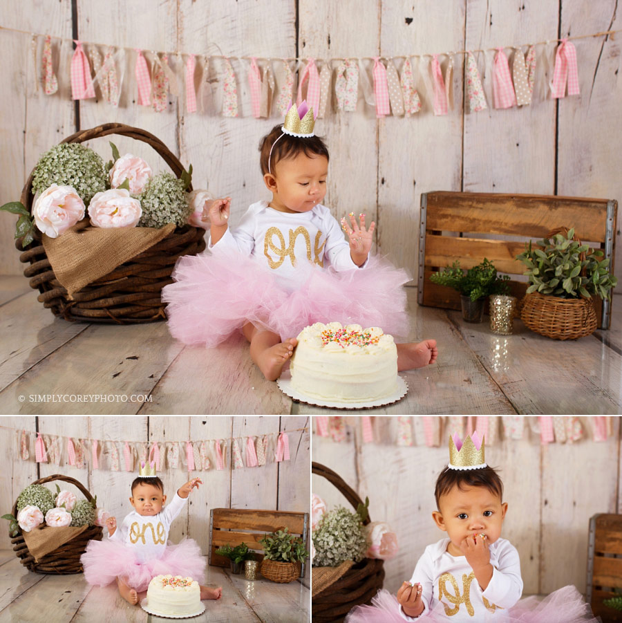 cake smash photographer Douglasville, baby girl in pink tutu with frosting on fingers