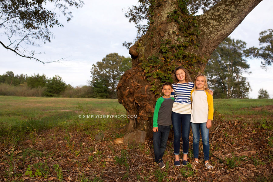 Villa Rica family photography, children outside near a large tree