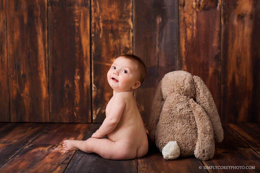 Bremen baby photographer, boy sitting next to a bunny in studio