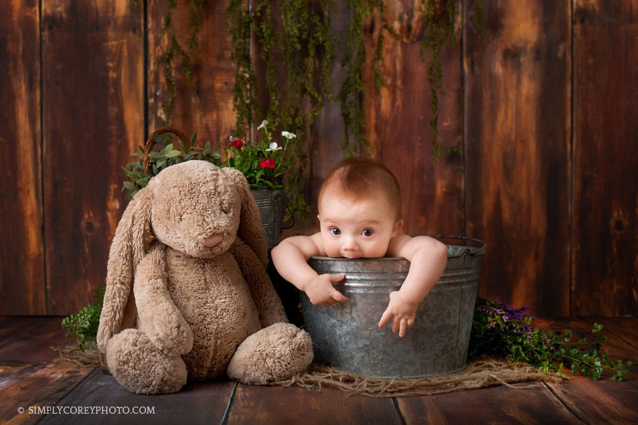 Carrollton baby photographer, boy chewing on a bucket with a bunny