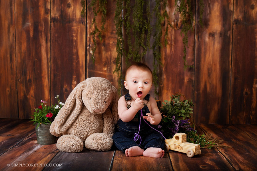 Villa Rica baby photographer, baby boy with a wooden truck and bunny in studio