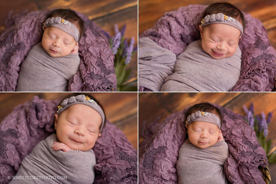 newborn photographer Douglasville, smiling baby girl in a purple wrap