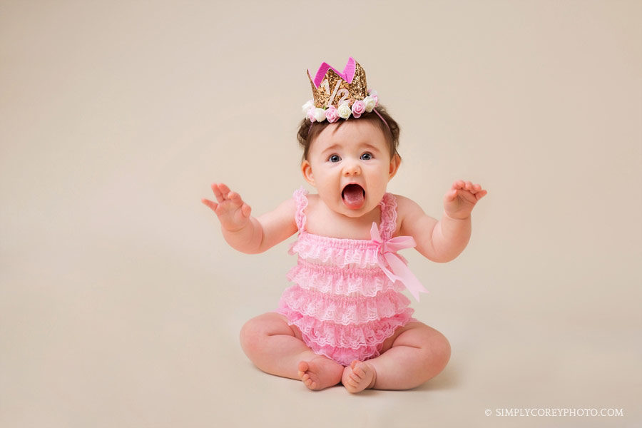 baby photographer Douglasville, girl in pink lace romper with crown