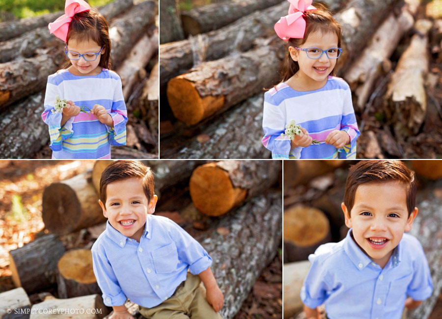 Newnan children's photographer, brother and sister outside by a log pile