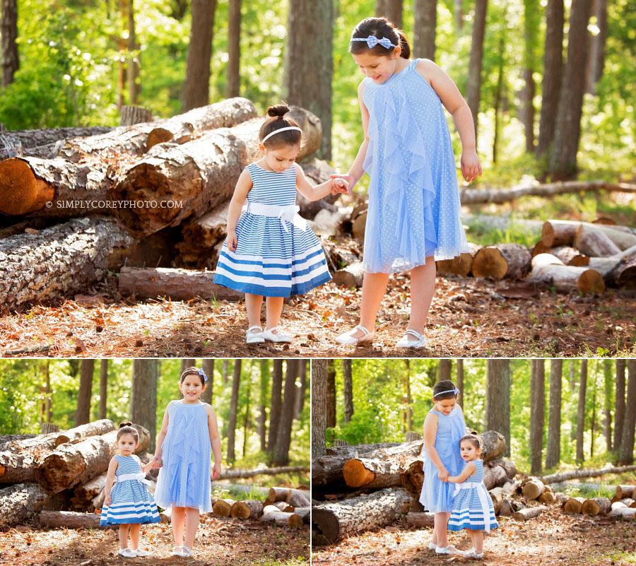 Newnan children's photographer, sisters outside in blue dresses
