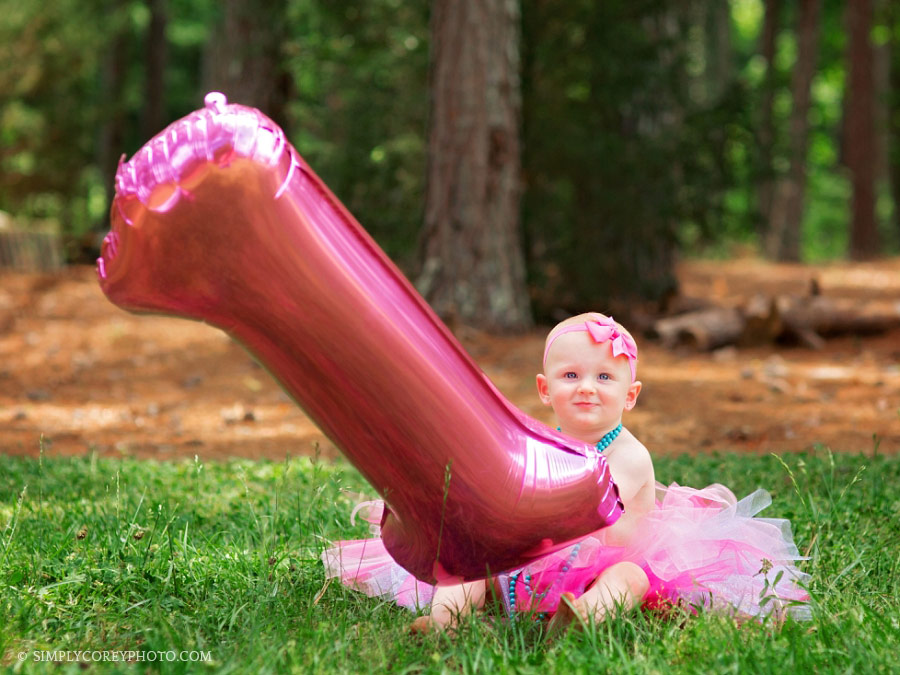 Douglasville baby photographer, girl in tutu with a one balloon outside
