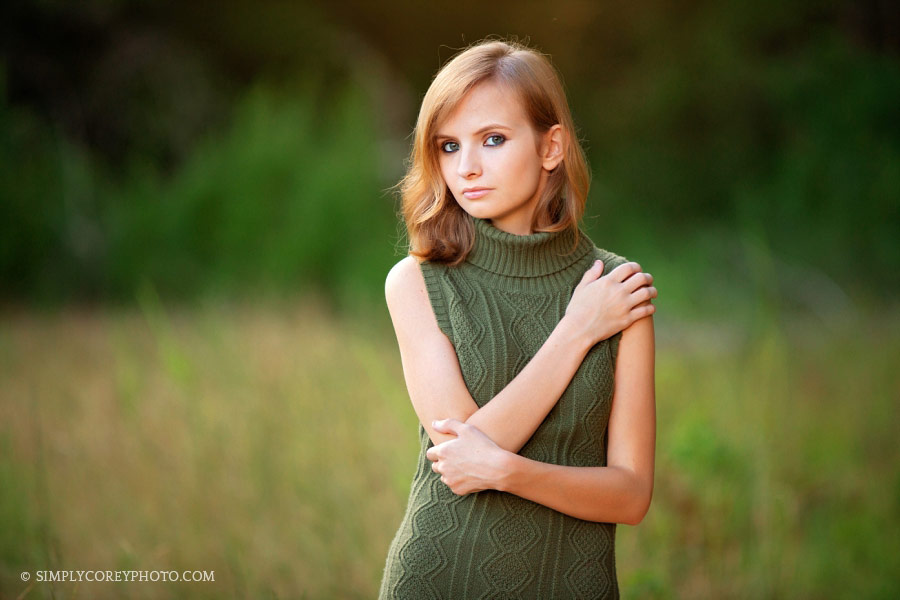 Newnan senior portrait photographer, teen girl in green outside