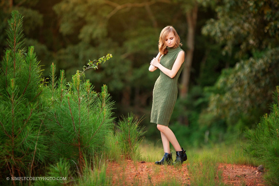 senior portrait photographer near Douglasville, teen girl outside in green